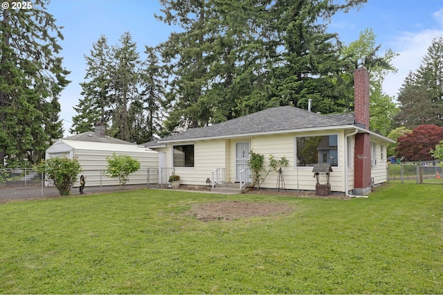 view of front of house featuring entry steps, a chimney, and roof with shingles