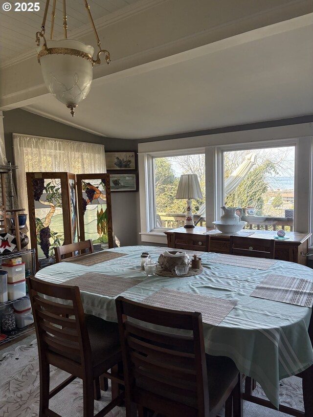 dining area with plenty of natural light and ornamental molding