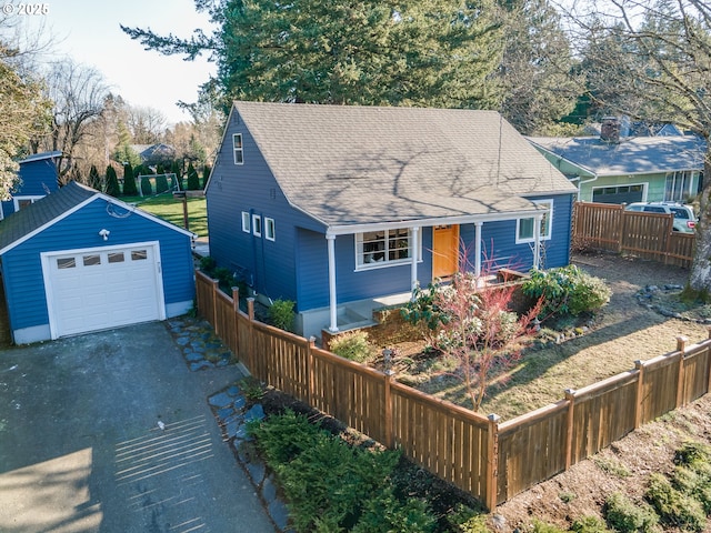 view of front of house featuring a garage and an outdoor structure