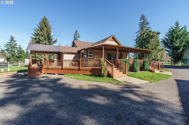 view of front of home featuring a wooden deck