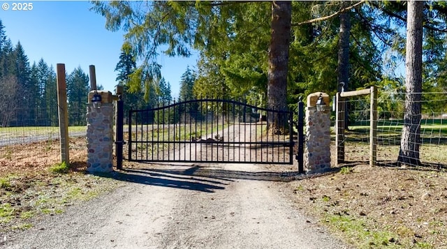 view of gate featuring fence