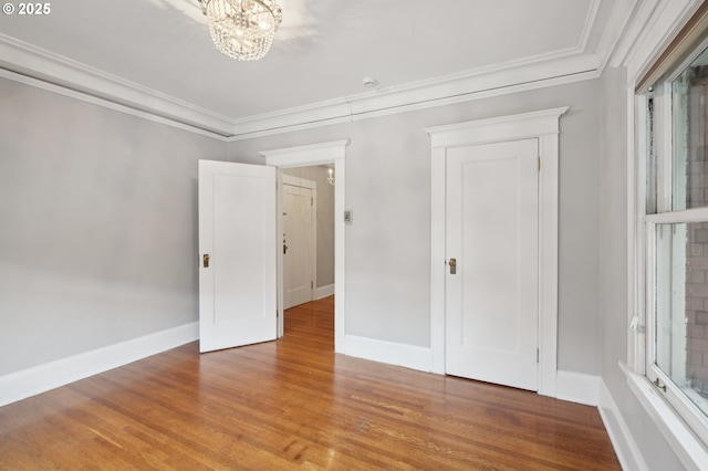 2083 NW Johnson St Unit 21, Portland, OR 97209 - spare room with a chandelier, wood finished floors, and crown molding