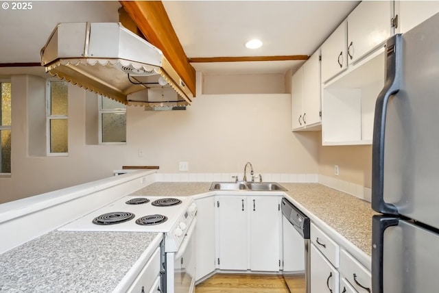 kitchen featuring freestanding refrigerator, a sink, white electric range, dishwashing machine, and light countertops