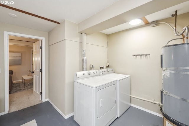 laundry room with separate washer and dryer, strapped water heater, and baseboards