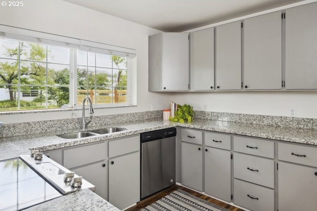 kitchen with dishwasher, a sink, dark wood-style floors, and black electric cooktop