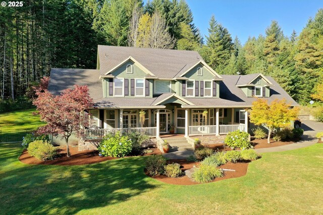 view of front of home with covered porch and a front yard