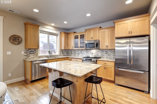 9350 SW Gertz Ln, Tualatin, OR 97062 - dining room featuring a chandelier, light wood-style flooring, recessed lighting, washer / clothes dryer, and baseboards