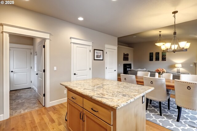 9350 SW Gertz Ln, Tualatin, OR 97062 - kitchen with a chandelier, a kitchen island, decorative light fixtures, recessed lighting, and open floor plan