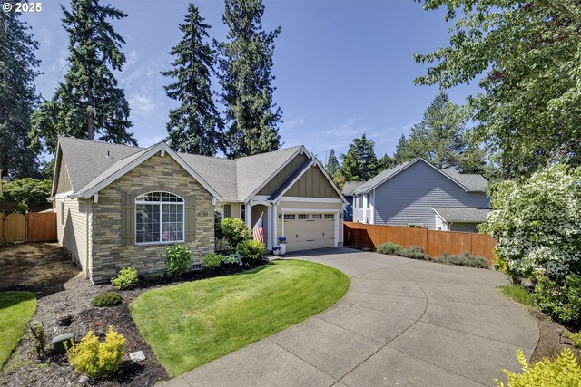 9350 SW Gertz Ln, Tualatin, OR 97062 - ranch-style house featuring a garage, driveway, board and batten siding, stone siding, and a shingled roof