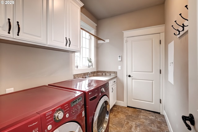 9350 SW Gertz Ln, Tualatin, OR 97062 - laundry room with washer and dryer, cabinet space, baseboards, and stone finish flooring