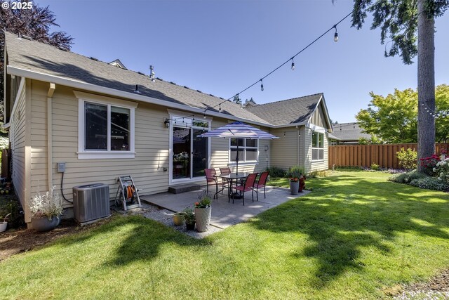 9350 SW Gertz Ln, Tualatin, OR 97062 - back of house with central air condition unit and a patio