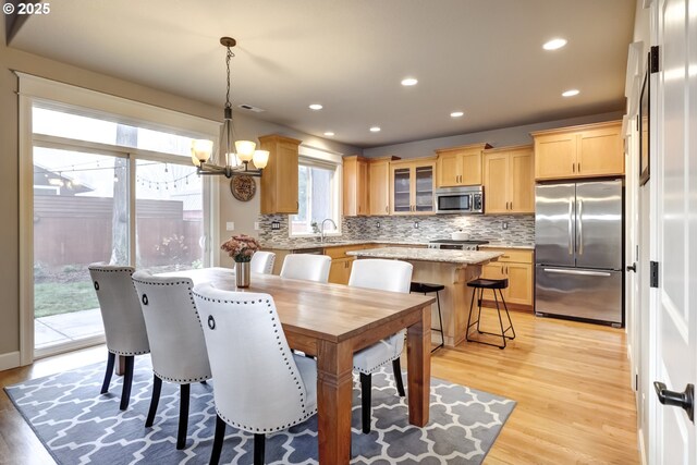 9350 SW Gertz Ln, Tualatin, OR 97062 - dining space with a chandelier, light wood-type flooring, and recessed lighting
