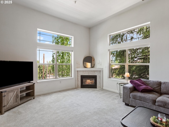 12130 NE Fremont St Unit 4, Portland, OR 97220 - carpeted living area with a glass covered fireplace and baseboards