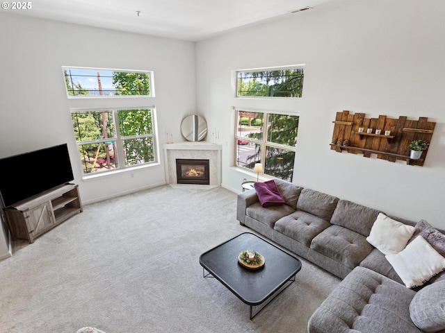 12130 NE Fremont St Unit 4, Portland, OR 97220 - living room with plenty of natural light, carpet floors, and a fireplace