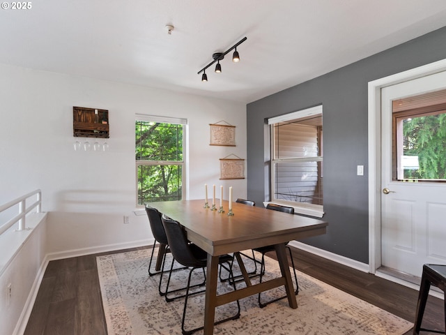 12130 NE Fremont St Unit 4, Portland, OR 97220 - dining space featuring dark wood-style floors and rail lighting