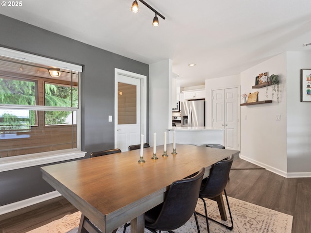 12130 NE Fremont St Unit 4, Portland, OR 97220 - dining room featuring baseboards and dark wood-style floors