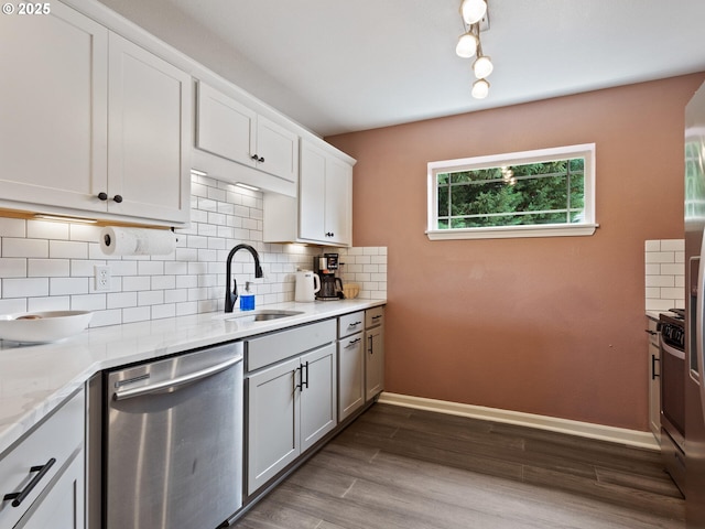 12130 NE Fremont St Unit 4, Portland, OR 97220 - kitchen featuring dishwasher, decorative backsplash, dark wood-style floors, white cabinets, and light stone countertops