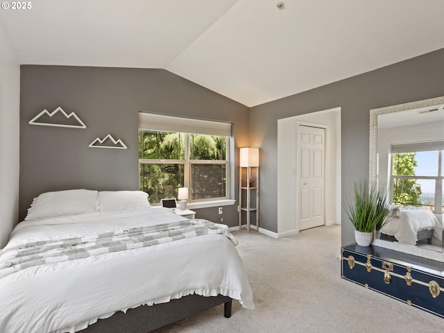 12130 NE Fremont St Unit 4, Portland, OR 97220 - bedroom featuring multiple windows, vaulted ceiling, and carpet floors