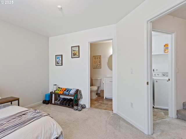 12130 NE Fremont St Unit 4, Portland, OR 97220 - bedroom with washer / clothes dryer, carpet floors, and ensuite bathroom