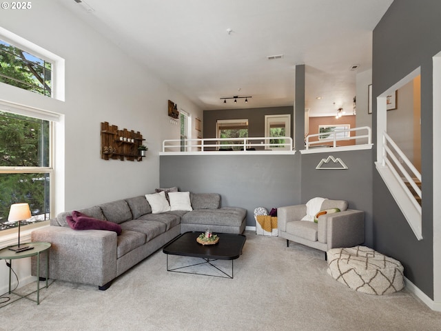 12130 NE Fremont St Unit 4, Portland, OR 97220 - carpeted living room featuring baseboards
