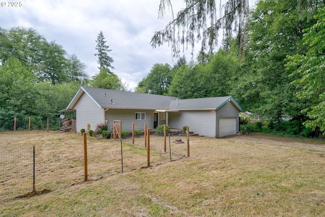 82548 Vinemaple Rd, Seaside, OR 97138 - back of house with a garage, a yard, and view of scattered trees