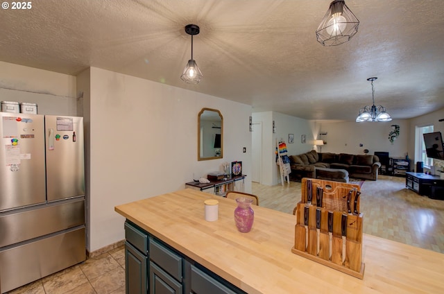 82548 Vinemaple Rd, Seaside, OR 97138 - dining space with a textured ceiling and a chandelier