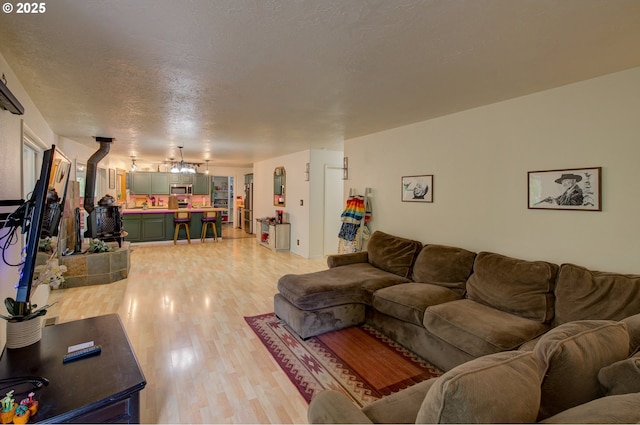 82548 Vinemaple Rd, Seaside, OR 97138 - living room featuring light wood-type flooring and a textured ceiling