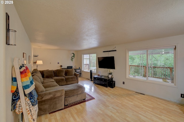 82548 Vinemaple Rd, Seaside, OR 97138 - living area featuring wood finished floors and a textured ceiling