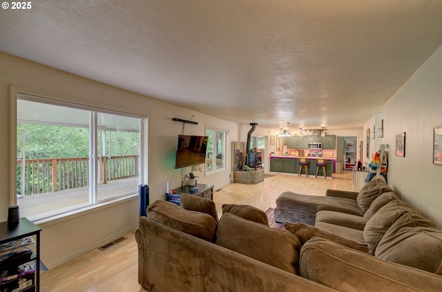 82548 Vinemaple Rd, Seaside, OR 97138 - living room with a textured ceiling and light wood-type flooring
