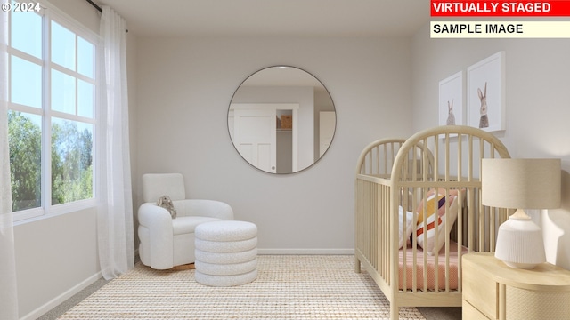 bedroom with a crib and multiple windows