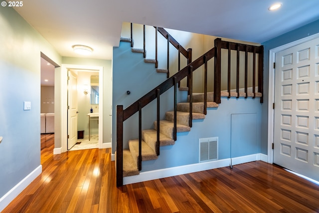 6900 SW Preslynn Dr, Portland, OR 97225 - stairway with hardwood / wood-style floors, baseboards, and recessed lighting