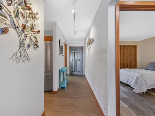1 3rd St Unit 204, Astoria, OR 97103 - hallway with rail lighting and baseboards