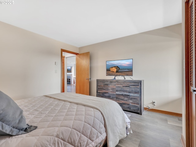 1 3rd St Unit 204, Astoria, OR 97103 - bedroom with wood finished floors and baseboards
