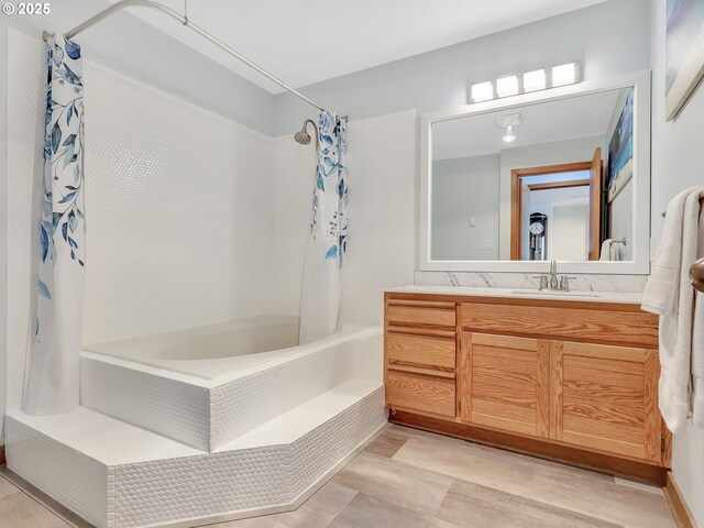 1 3rd St Unit 204, Astoria, OR 97103 - full bathroom with shower / tub combo with curtain, vanity, and wood finished floors