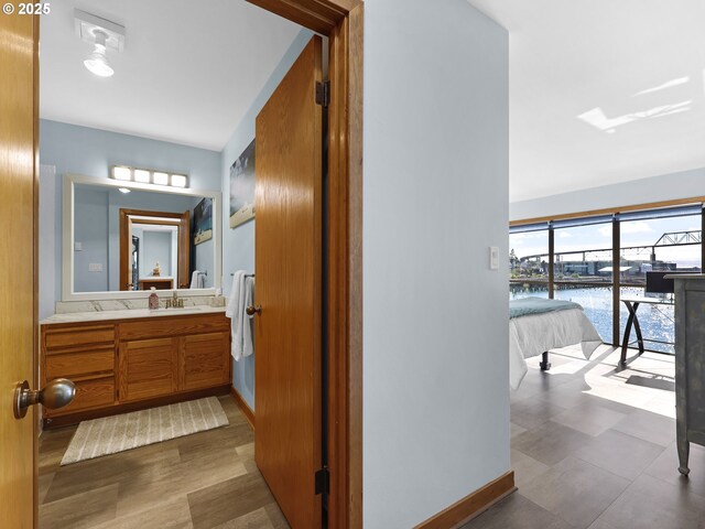 1 3rd St Unit 204, Astoria, OR 97103 - bathroom featuring vanity, a water view, and baseboards