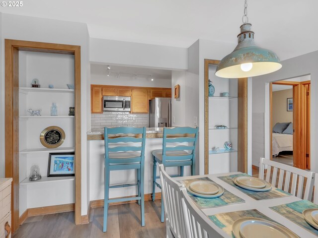 1 3rd St Unit 204, Astoria, OR 97103 - dining area featuring wood finished floors