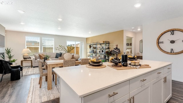262 Greencrest St, Salem, OR 97301 - kitchen featuring dark wood-style flooring, recessed lighting, white cabinetry, a center island, and light countertops