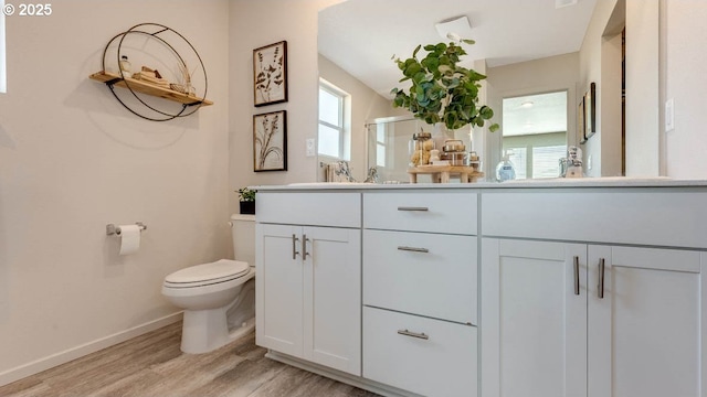 262 Greencrest St, Salem, OR 97301 - bathroom featuring double vanity, wood finished floors, and a stall shower
