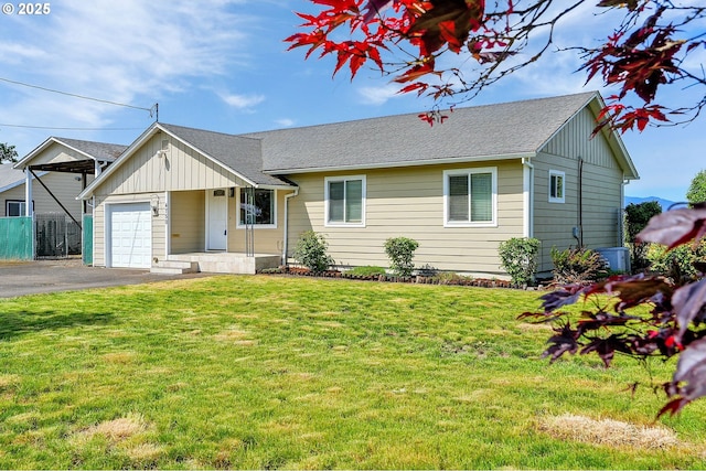 4750 SW 3rd St, Corvallis, OR 97333 - single story home featuring asphalt driveway, an attached garage, board and batten siding, and roof with shingles