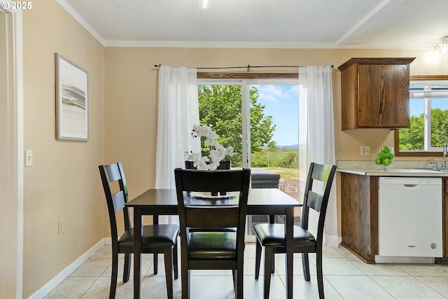 4750 SW 3rd St, Corvallis, OR 97333 - dining room featuring light tile patterned floors, crown molding, and baseboards