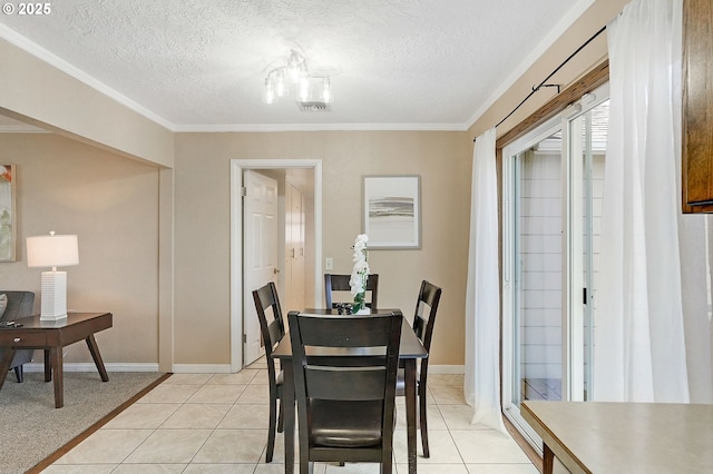 4750 SW 3rd St, Corvallis, OR 97333 - dining space with ornamental molding, a textured ceiling, light tile patterned flooring, and baseboards