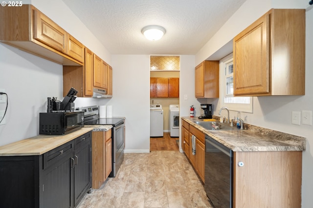 kitchen with black microwave, stainless steel electric range oven, dishwasher, a sink, and washer and dryer