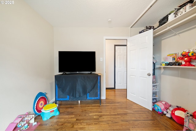 game room featuring wood finished floors