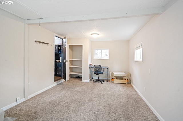 sitting room featuring carpet flooring and baseboards