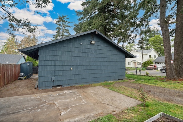 exterior space with fence and an outdoor structure