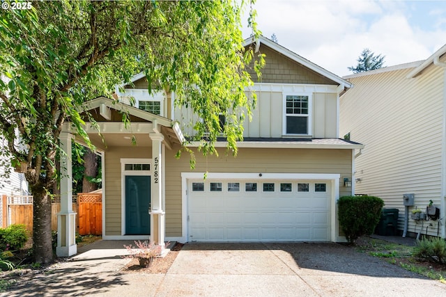 5782 NE Canard Ct, Hillsboro, OR 97124 - view of front of property with board and batten siding, driveway, and a garage