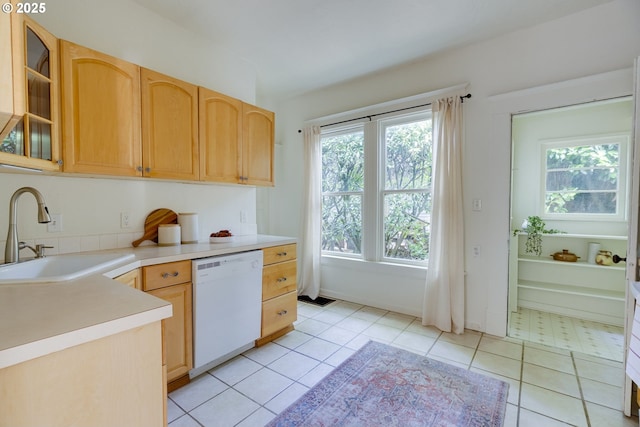 8052 NE Couch St, Portland, OR 97213 - kitchen featuring dishwasher, healthy amount of natural light, glass insert cabinets, and light countertops