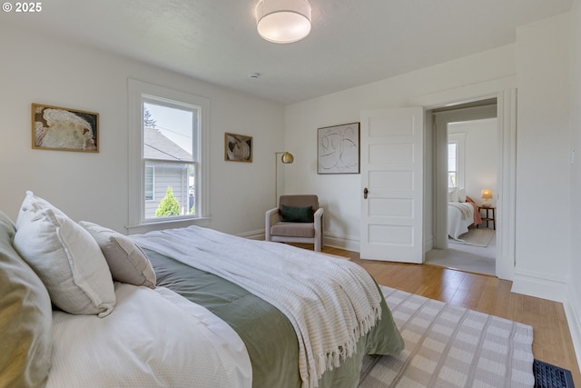 8052 NE Couch St, Portland, OR 97213 - bedroom with light wood finished floors and baseboards