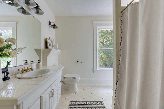 8052 NE Couch St, Portland, OR 97213 - bathroom with vanity, tile patterned floors, and curtained shower