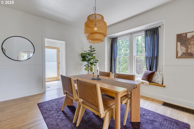 8052 NE Couch St, Portland, OR 97213 - dining room featuring wood finished floors and baseboards